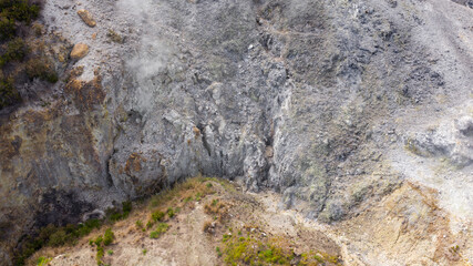 Aerial view of Solfatara of Pozzuoli, near Naples, Italy. It is a dormant volcano and part of the Phlegraean Fields volcanic area. It emits jets of steam with sulfurous fumes.