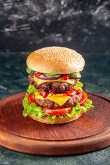 High resolution photo of tasty sandwich on wooden board on dark color background