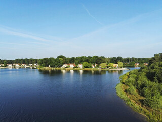 Fototapeta na wymiar Holiday homes along a lake in Limburg Netherlands