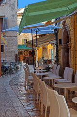 Medieval Croatian old street,with street cafe in Porec, Istria - 594758787