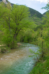 View of Sentino river in the mountains near the famous Grotte di Frasassi in Genga, Marche region, Italy