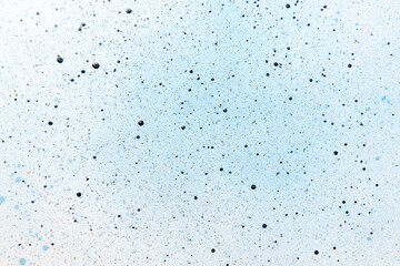 above view blue paints with dark spots on white surface artist photo bright art painting color exhibition frame horizontal