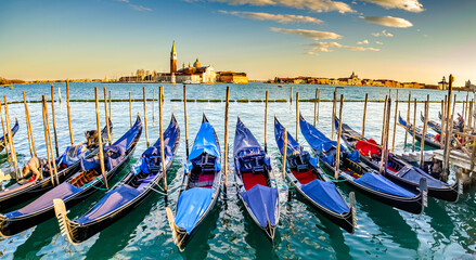 Fototapeta na wymiar typical Gondolas at the Sankt Markus Square in Venice
