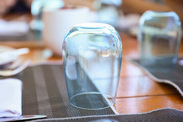 fancy glass at a dining table symbolizes elegance, refinement, sophistication, and adds to the aesthetic appeal of formal dining