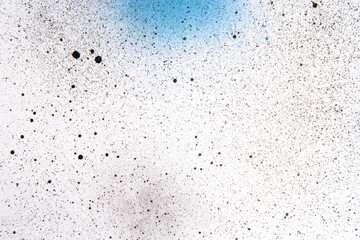 above view white surface with blue paints and dark spots painting artist horizontal dust art color...