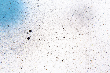 above view white surface with blue paints and dark spots painting horizontal dust art color photo