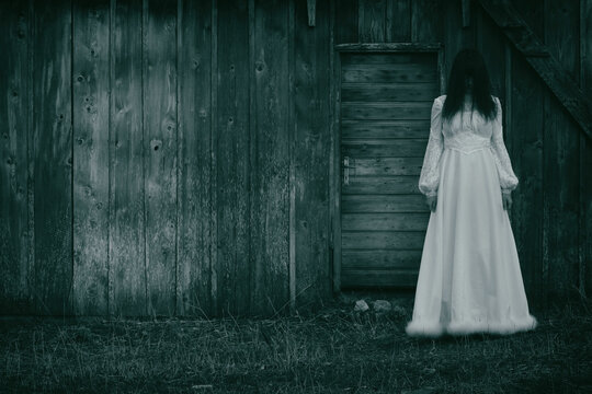 Horror scene of woman in white dress