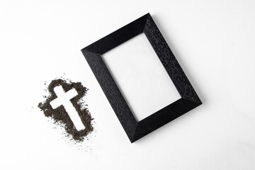 top view cross shape with picture frame on the white surface grim reaper funeral death