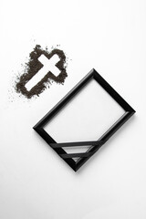 top view cross shape with picture frame white surface soil grim reaper funeral death