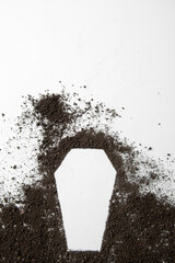 top view of coffin shape with dark soil on the white background grim reaper funeral death