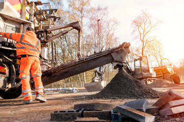 Concrete delivered on the construction site and offloaded from a volumetric concrete mixer