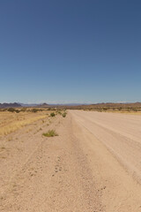 scenic view of an empty gravel road in Namibia