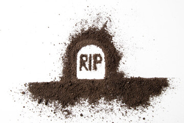 top view of grave shape with rip inscription on a white surface funeral death grim reaper