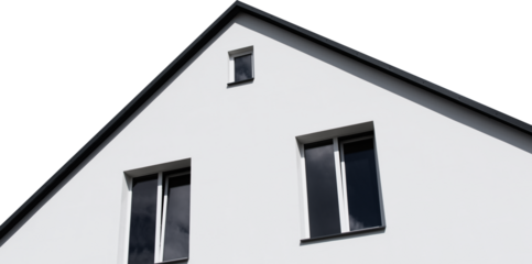 A fragment of a residential private house with windows and a new roof against a cloudy sky