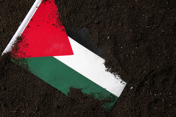 top view of palestinian flag on dark soil death palestine funeral