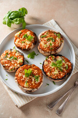 Stuffed champignon portobello stuffed with tomatoes sauce and cheese. 