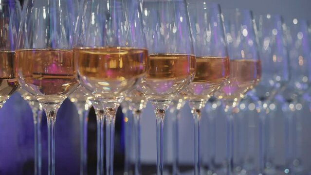 Wine glasses at a party, corporate event, celebration, white wine, red wine, crystal glass, alcohol, alcoholic beverages, function room, awards ceremony