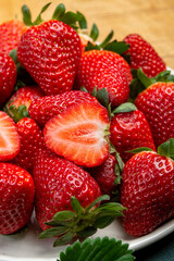 New harvest, board with fresh ripe red sweet Spanish strawberry