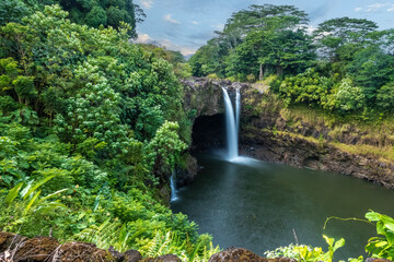 Rainbow (Waianuenue) Falls is a waterfall, Hilo, Hawaii, USA. The Wailuku River rushes into a large pool below.