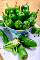 Fresh green mild padron pepper pementos, ready for grill or to be fried with olive oil, traditional snack in Galicia, Spain
