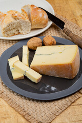 Cheese collection, French Morbier semi-soft cow milk cheese with black mold layer