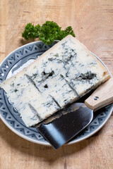 Italian food, buttery or firm blue cheese made from cow milk in Gorgonzola, Milan, Italy