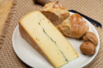 Cheese collection, French Morbier semi-soft cow milk cheese with black mold layer