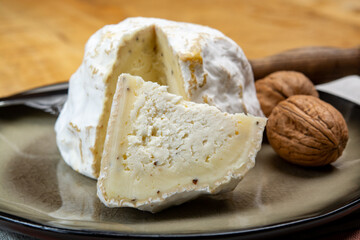 Cheese collection, soft cow French cheese with mold Gaperon artisanal lavored with cracked peppercorns and garlic produced in Auvergne