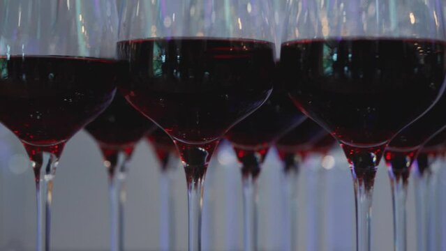 Wine glasses at a party, corporate event, celebration, white wine, red wine, crystal glass, alcohol, alcoholic beverages, function room, awards ceremony