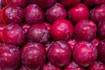 Plums fruit on the market for background