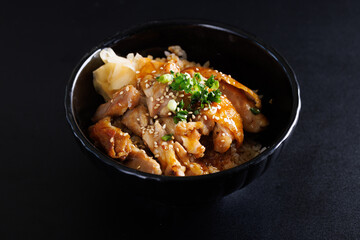 Grilled Chicken teriyaki rice Japanese food isolated in black background