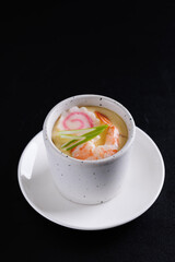 Japanese Traditional food Eggs Custard Chawanmushi isolated in black background