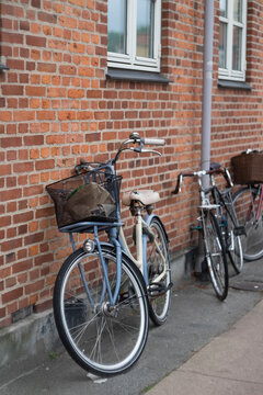 bicycle in front of a brick wall