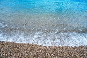Sveti Stefan beach with red stones in Budva