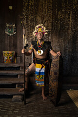 A Borneo man showcasing the beauty of her culture through stunning traditional clothing