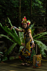 A Borneo lady showcasing the beauty of her culture through her stunning traditional clothing