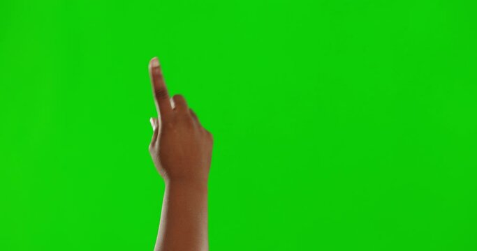 Hand, green screen and interface with a person or user in studio using an interactive ui or ux dashboard. App, internet and space with an adult indoor to click, press or push a button on chromakey
