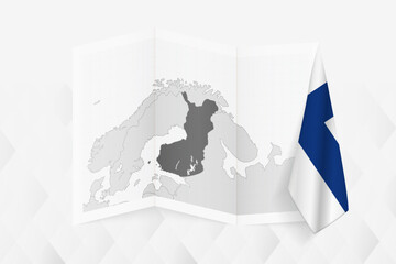 A grayscale map of Finland with a hanging Finnish flag on one side. Vector map for many types of news.