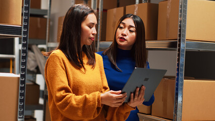 Team of people analyzing products in boxes, working with distribution and order shipment in storage...