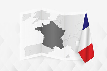 A grayscale map of France with a hanging French flag on one side. Vector map for many types of news.