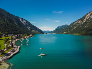Obraz premium Aerial view Achensee sea in Maurach, Tirol. Austria by drone. Alps mountains.