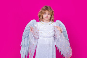 Angel child. Isolated studio shot. Cute kid with angel wings. Cupid, valentines day concept.