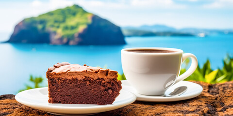 Mediterranean breakfast, a cup of coffee and a slice of chocolate cake with a beautiful sea view in the background. Summer holiday vacation concept.