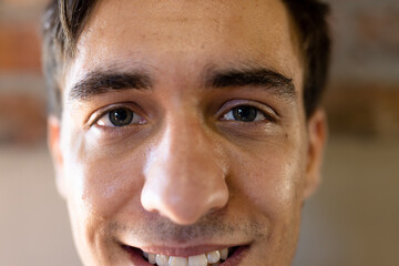 Portrait close up of happy caucasian casual businessman smiling