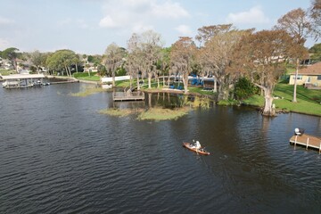 Fototapeta na wymiar A drone photograph of Lake Tarpon in Tarpon Springs, Florida, of a community park in a natural setting.