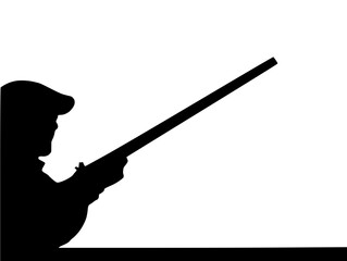 Silhouette of a clay pigeon shooter or hunter with a percussion rifle muzzle loader taking aim at a target