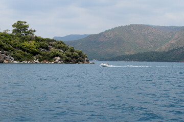 Ship in the sea against the backdrop of mountains