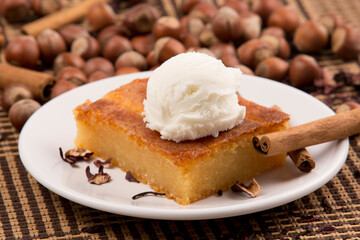 Ice Cream on cheese halvah with hazelnuts at background