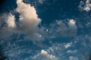 clouds and moon in daytime