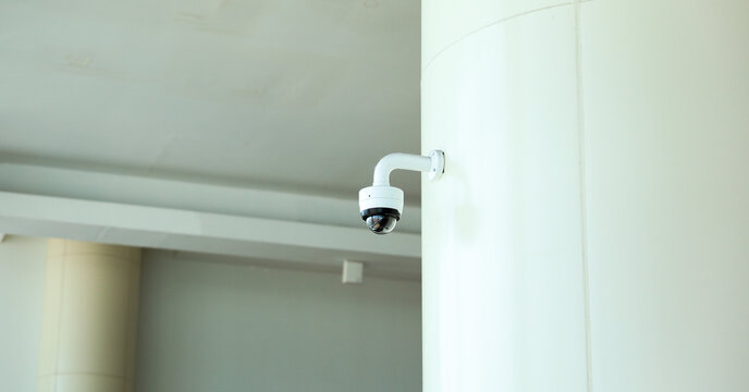 security camera in the image represents the use of technology for safety and protection. It symbolizes surveillance and monitoring as a means of preventing crime and detecting security breaches